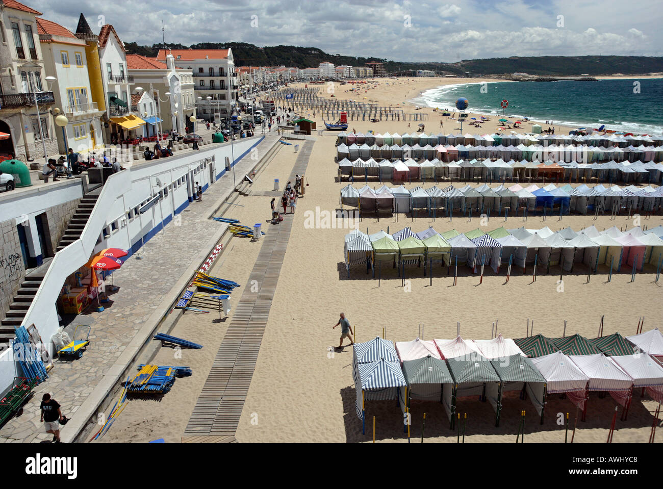 A view of the seasonal cabanas on the wide beaches at the coastal resort town of Nazaré on Portugal's Atlantic seaboard. Stock Photo