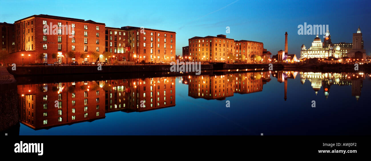 The Albert Dock warehouses are reflected in the water of Salthouse Dock, Liverpool. Stock Photo