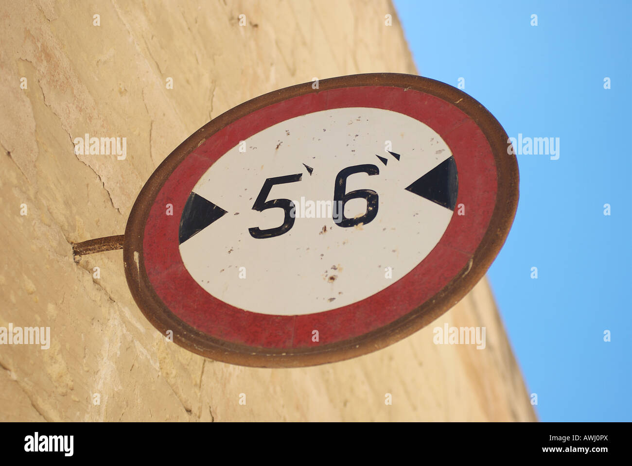 Road width sign on wall in Mdina Stock Photo