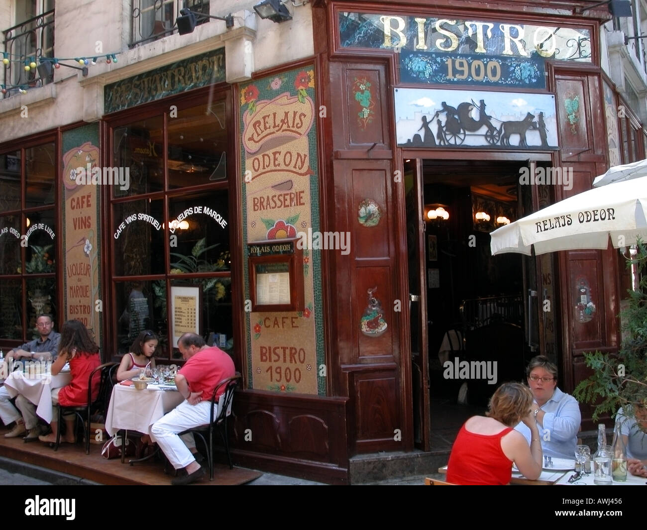 Paris Latin Quarter people eating outside bistro with Art Nouveau Stock