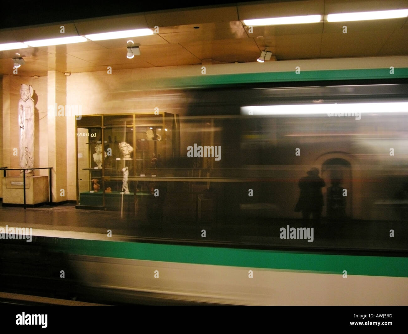 Paris underground train pulling into Louvre station Stock Photo