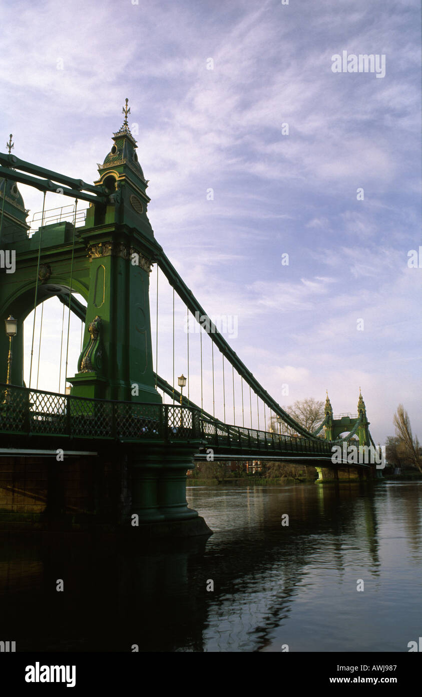 A view of Hammersmith suspension bridge in West London at dawn on the river Thames, England, UK