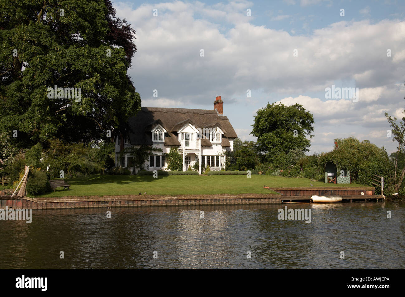 Traditional beautiful residential riverside house or home with jetty
