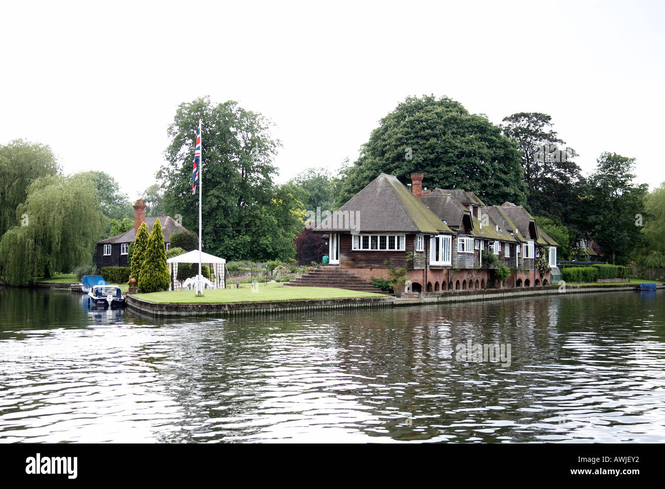 Beautiful luxury expensive residential houses or homes near Henley on Thames with motor yacht