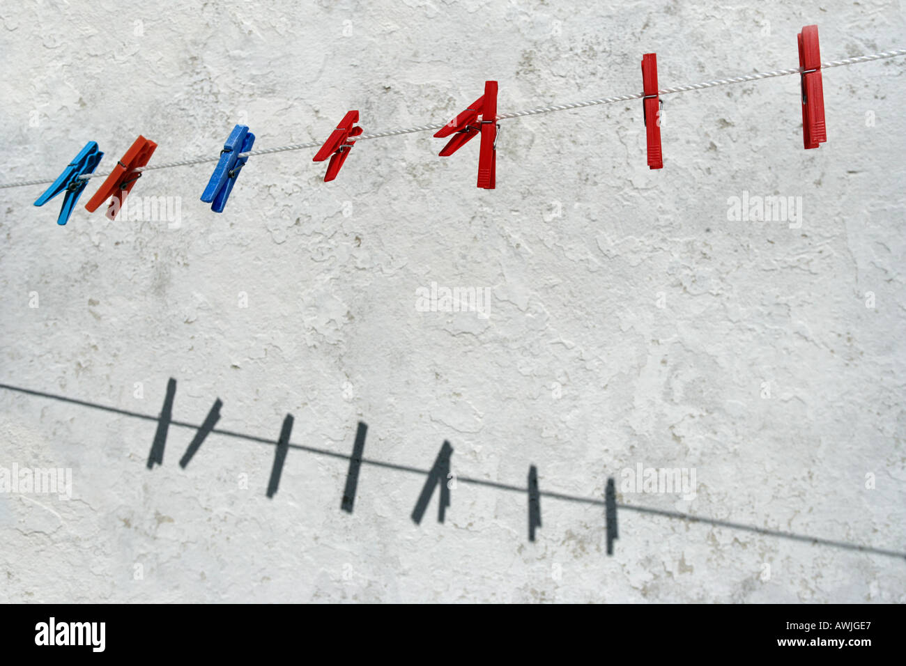 Colored plastic clothespins hanging from a clothes line Stock Photo Alamy
