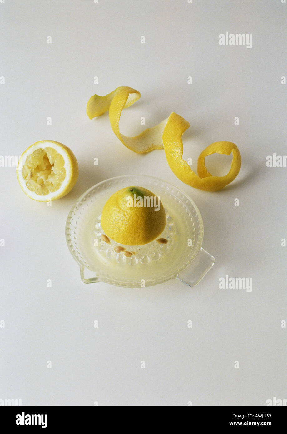 Lemon on lemon press and lemon peel Stock Photo