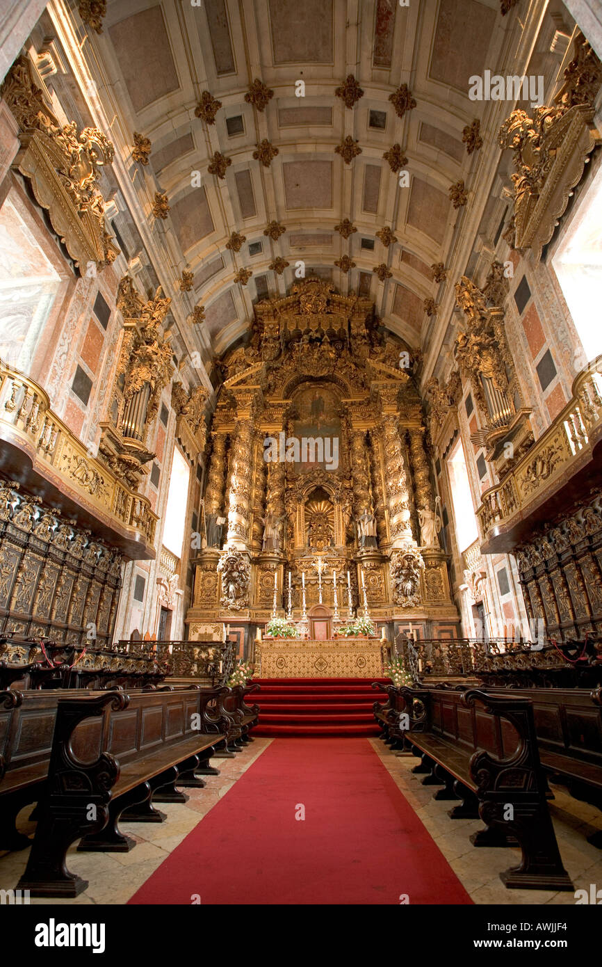 A heavily carved and gilded alter inside the cathedral of Porto Portugal Stock Photo