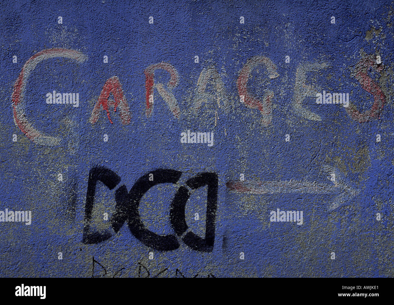 Garages type painted on blue wall Stock Photo Alamy