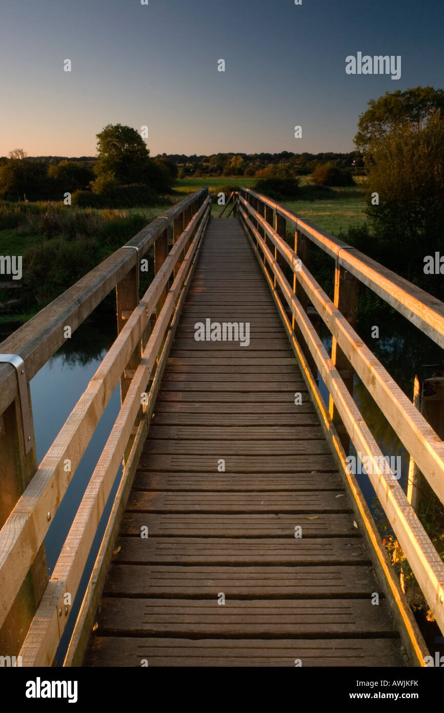 Wooden footbridge across the River Stour near Wimborne in Dorset. Known locally as Eyebridge. Stock Photo