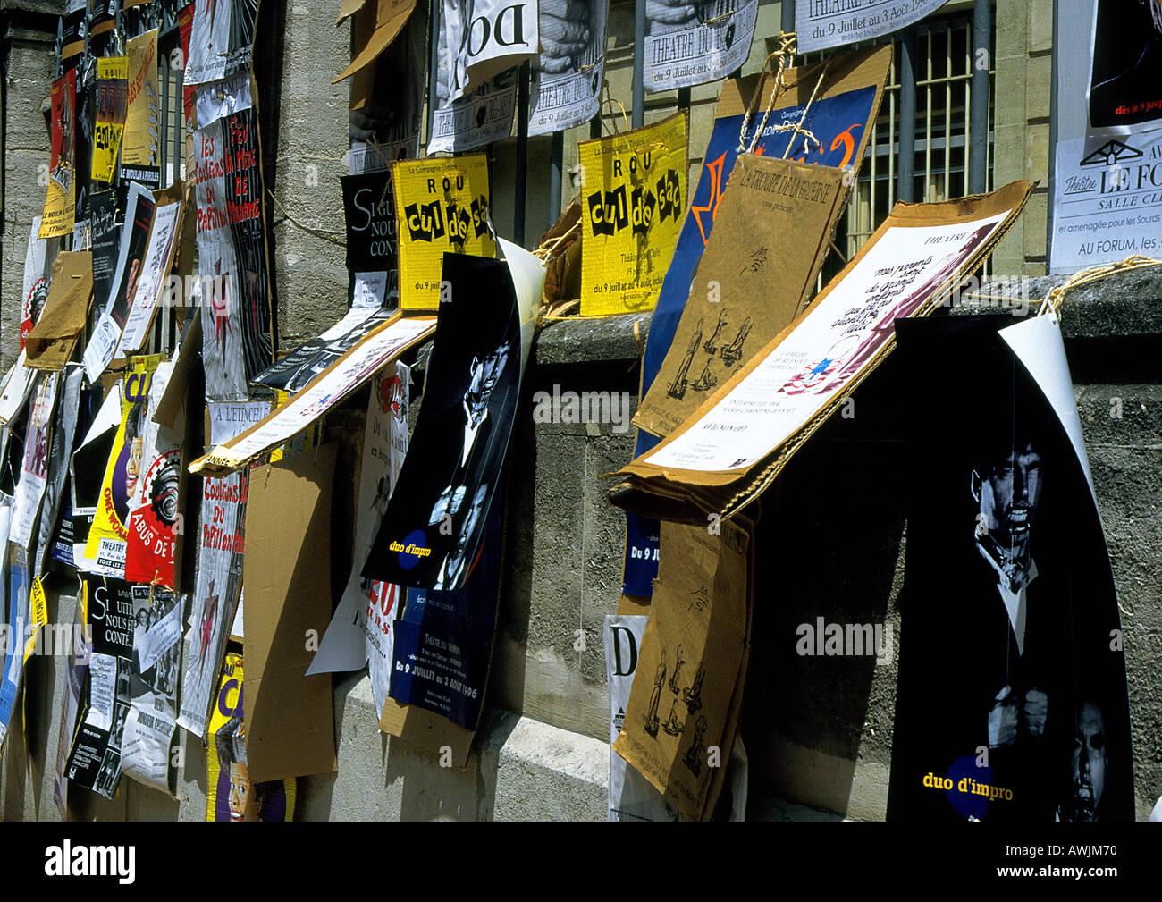 Collection of posters and signs on wall Stock Photo Alamy