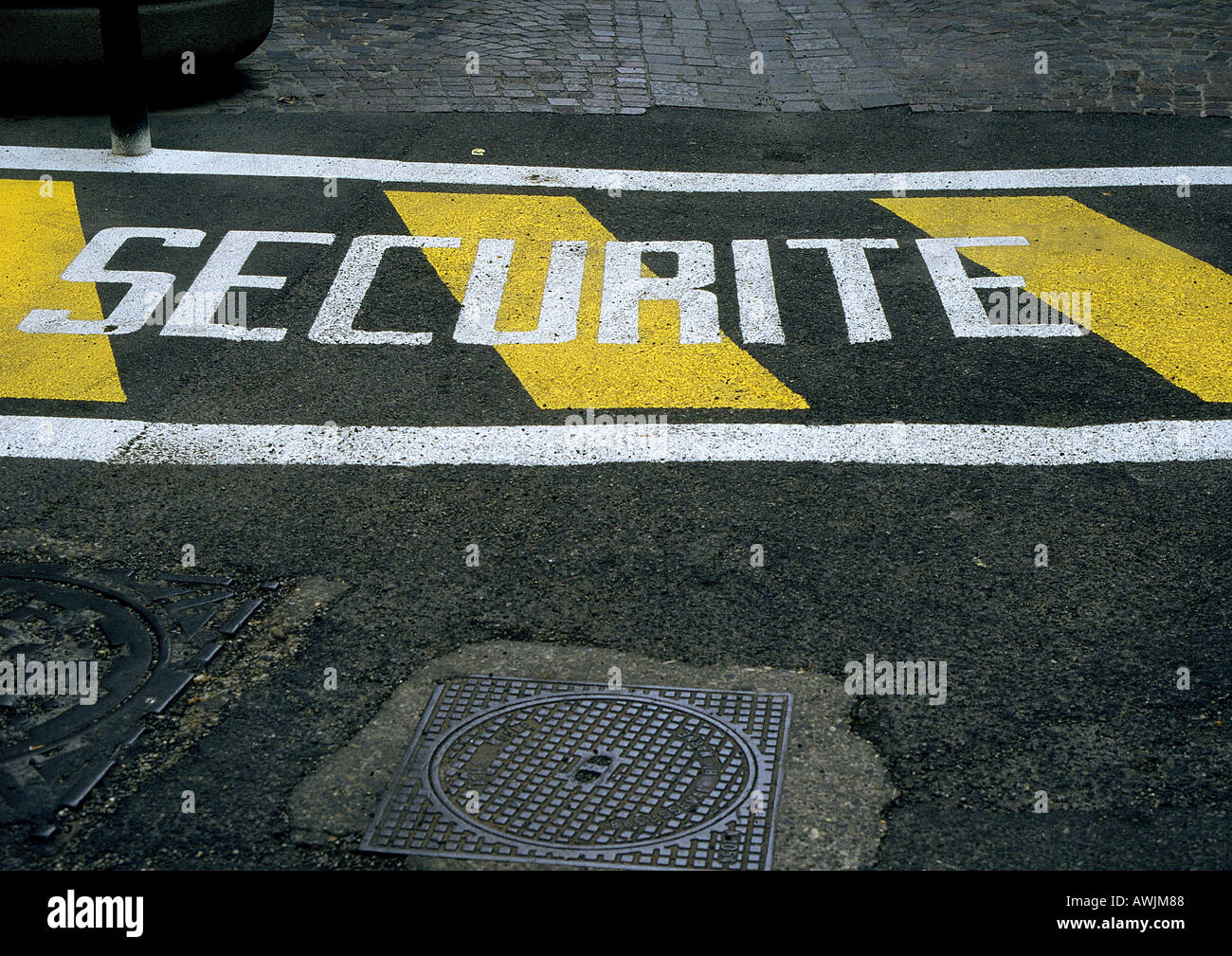 Safety stenciled text in French on street Stock Photo Alamy