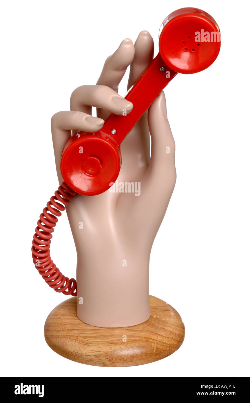 Mannequin hand holding a red telephone receiver Stock Photo