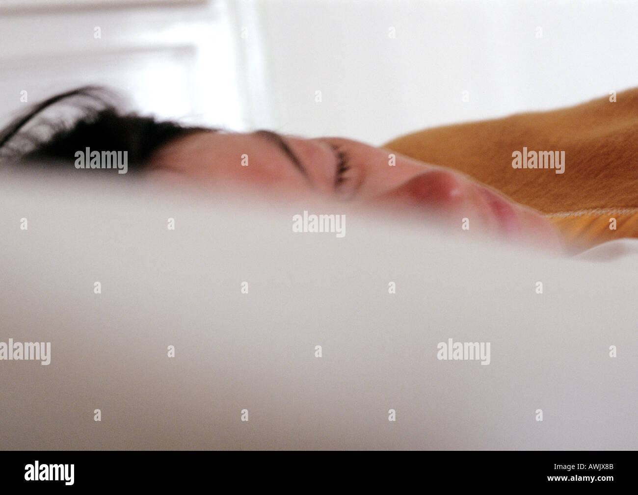 Woman sleeping in bed. Stock Photo