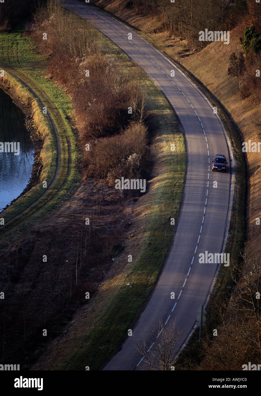 Car on hillside road Stock Photo - Alamy