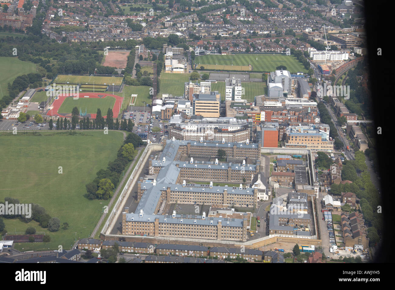 High level oblique aerial view east of Wormwood Scrubs Linford Christie