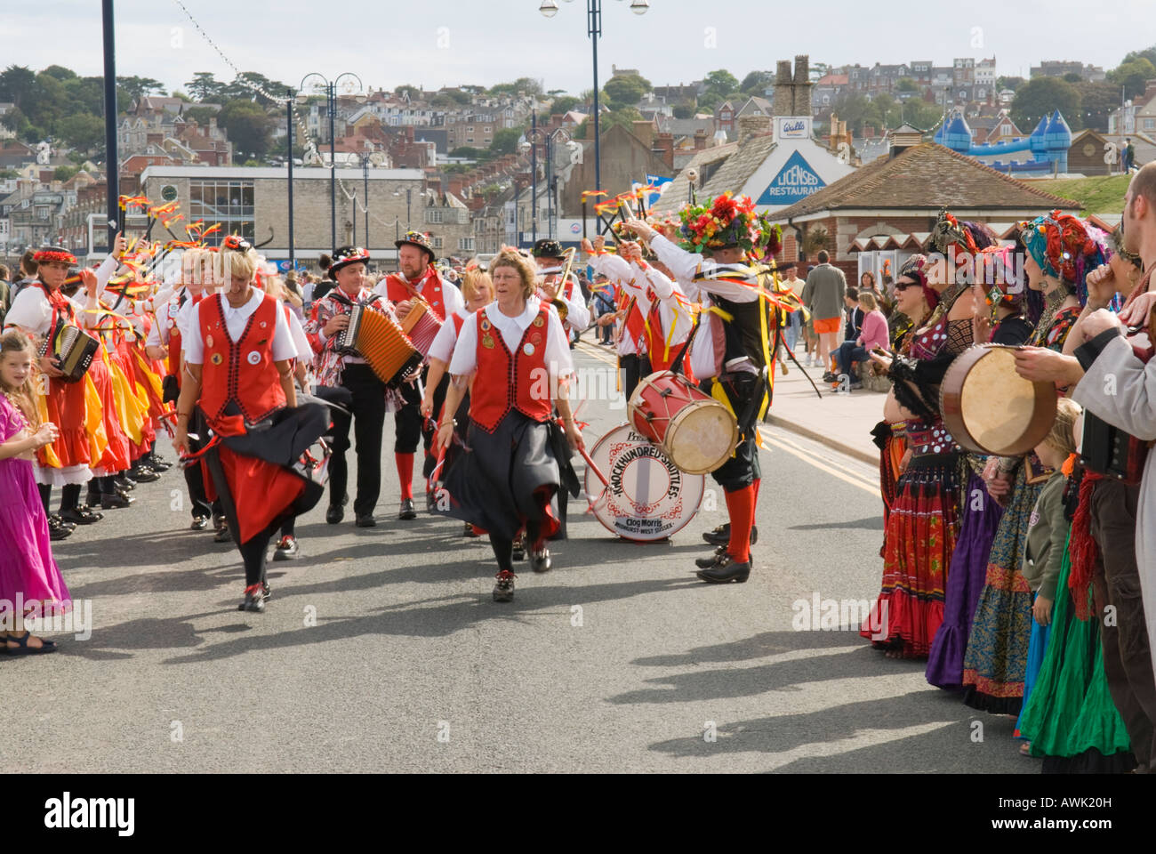 Swanage, Dorset, UK. Swange Folk Festival, Dancers in parade along sea front. September Stock Photo