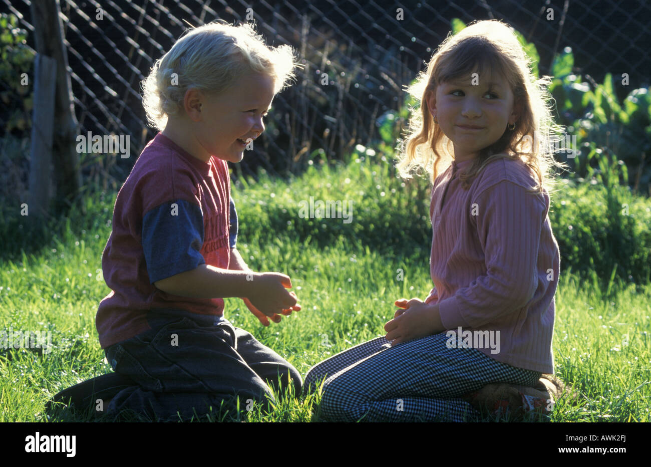 children playing together outdoors Stock Photo
