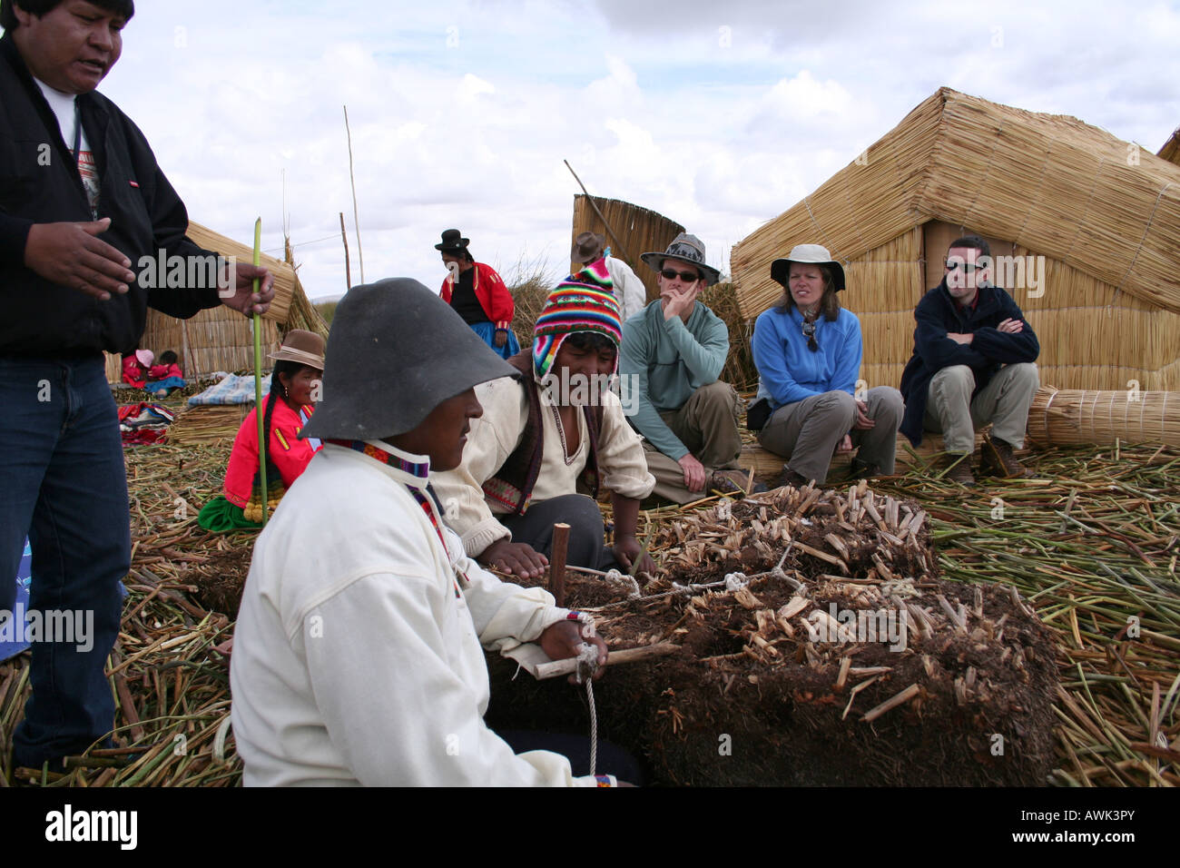 Tourists on Uros floating reed island Stock Photo Alamy