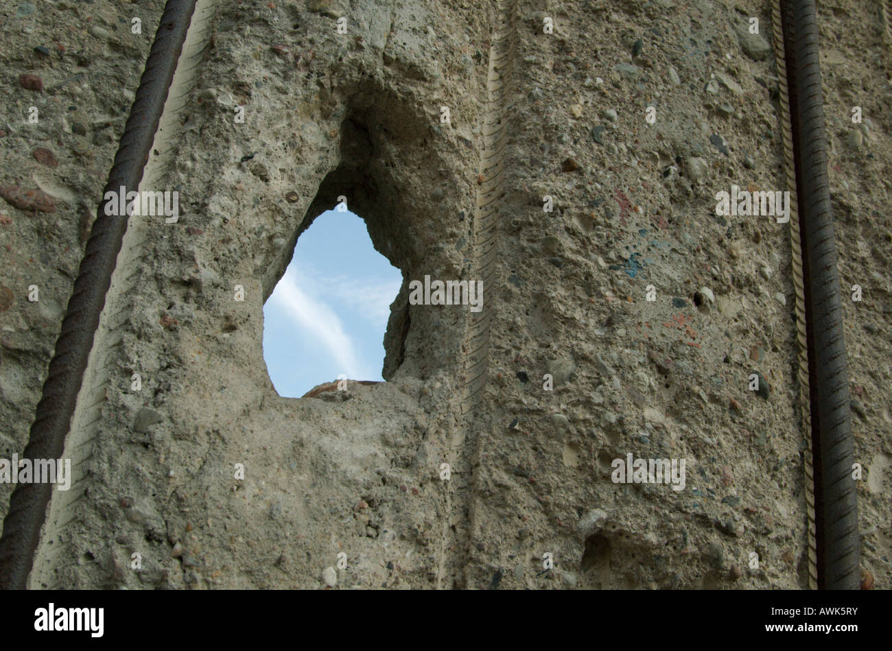 Looking through a hole into freedom: Berlin Wall monument Bernauer Strasse. Berlin, Mitte. Stock Photo