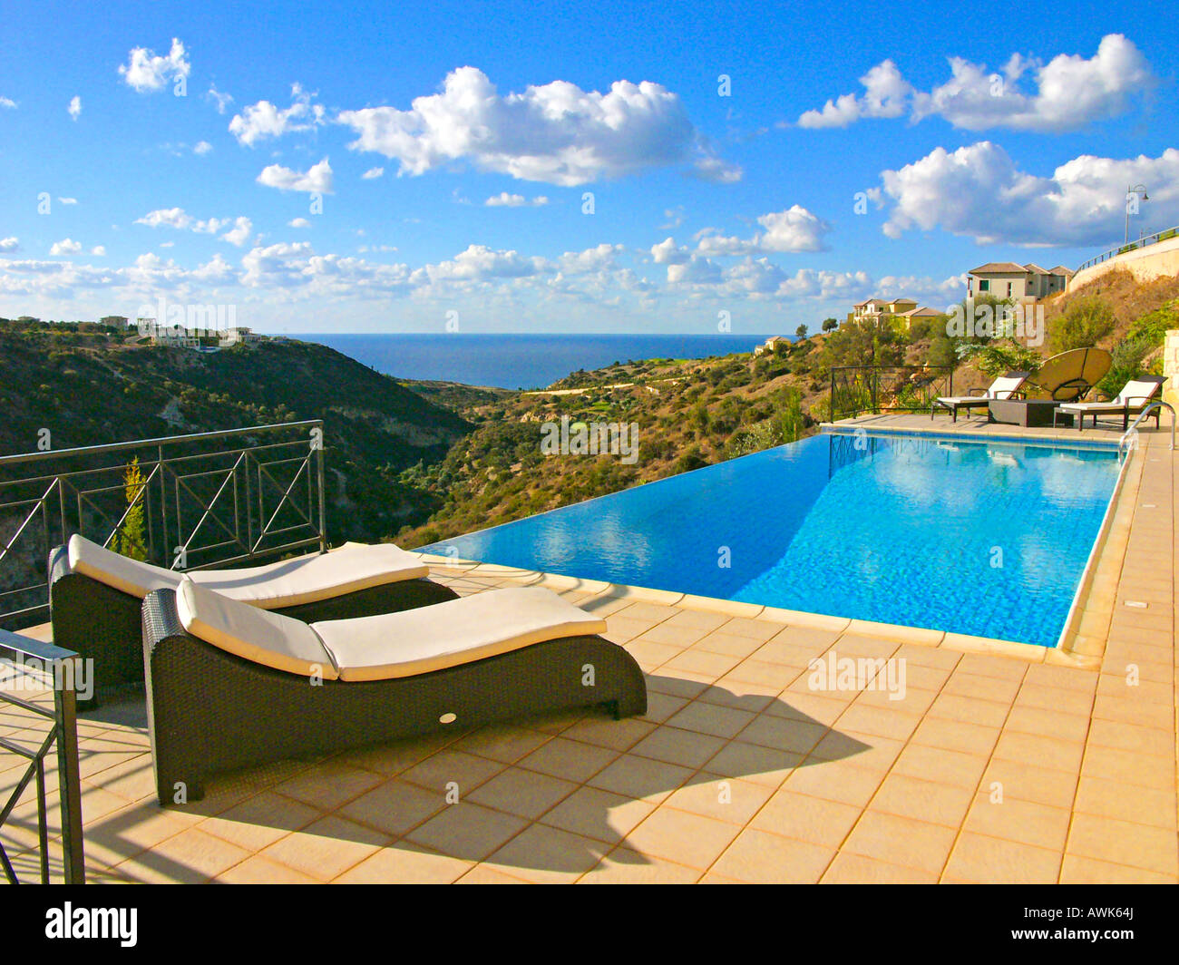 An infinity outdoor swimming pool in Aphrodite Hills village near Paphos Cyprus EU Stock Photo