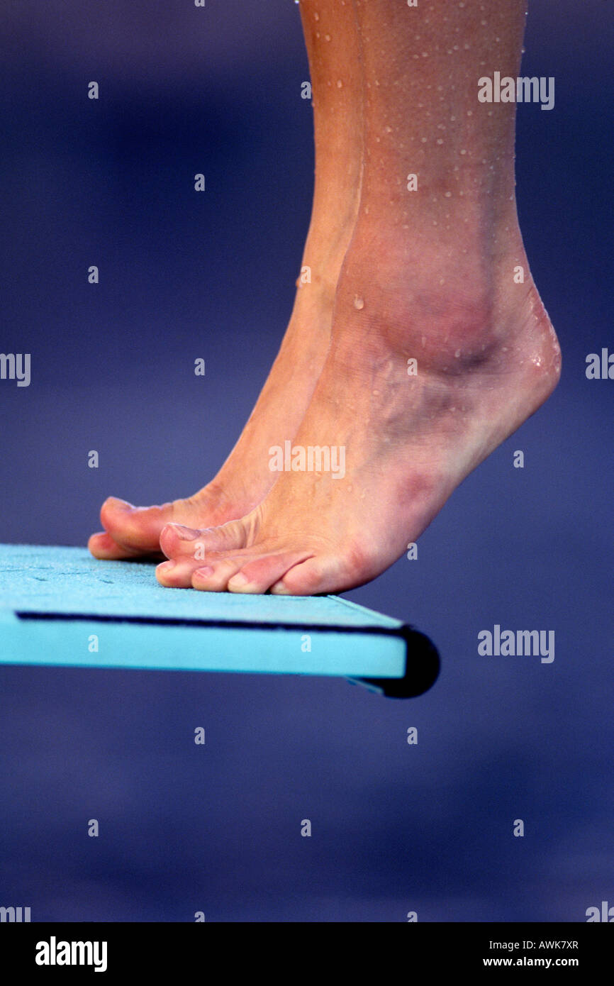 Detail of divers feet on the diving board Stock Photo