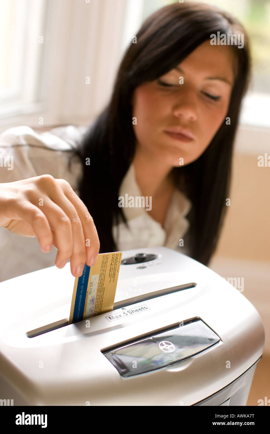 woman shredding credit card Stock Photo