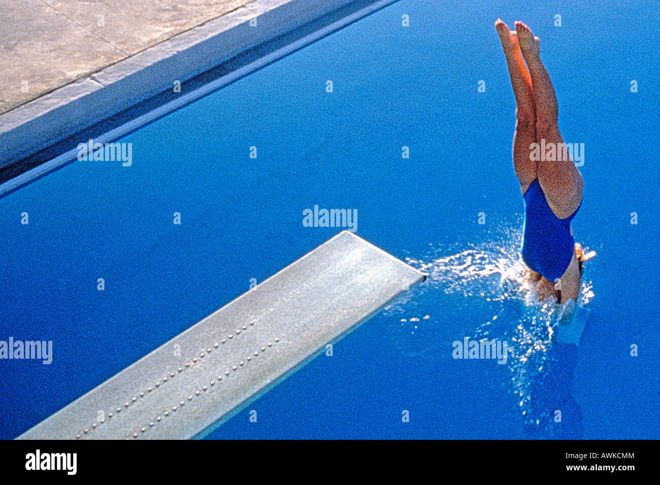Women diving into the pool Stock Photo Alamy