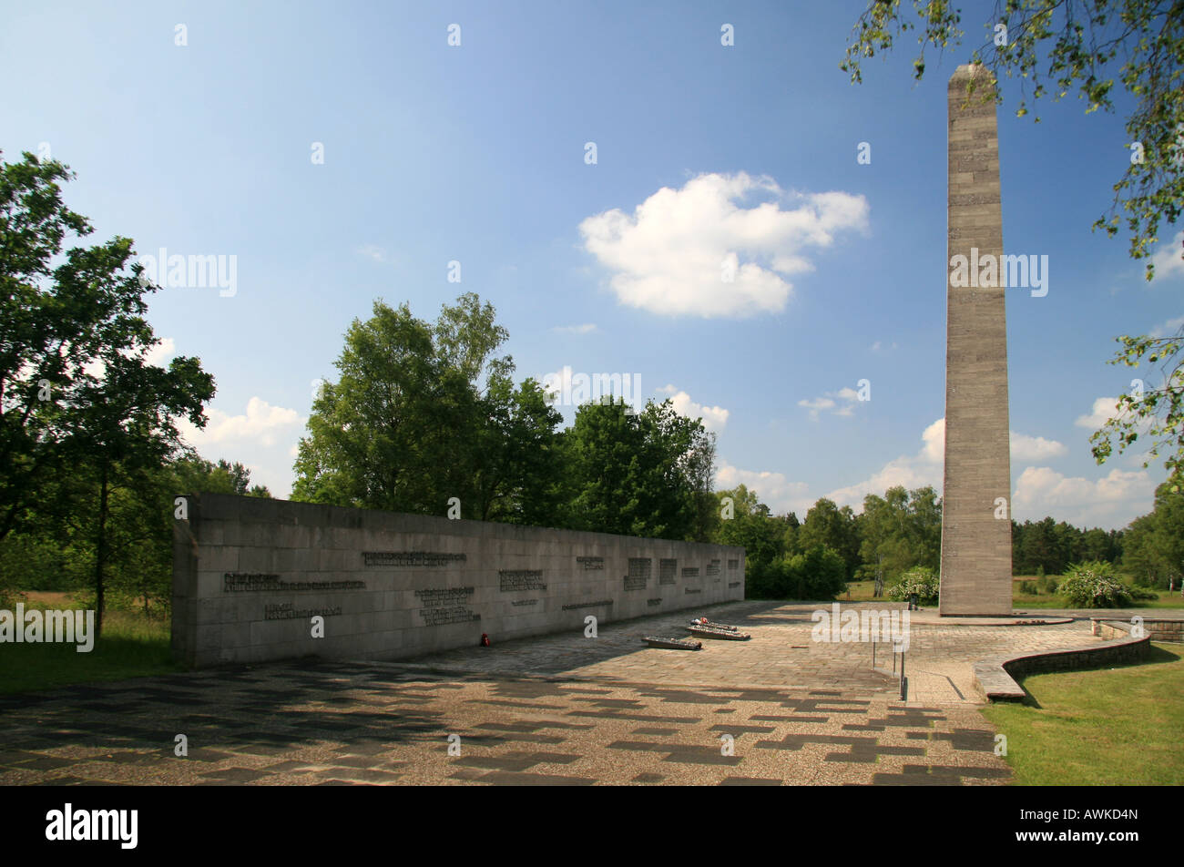 The Obelisk and Inscription Wall in the main memorial area of the former Nazi concentration camp at Bergen Belsen, Germany. Stock Photo