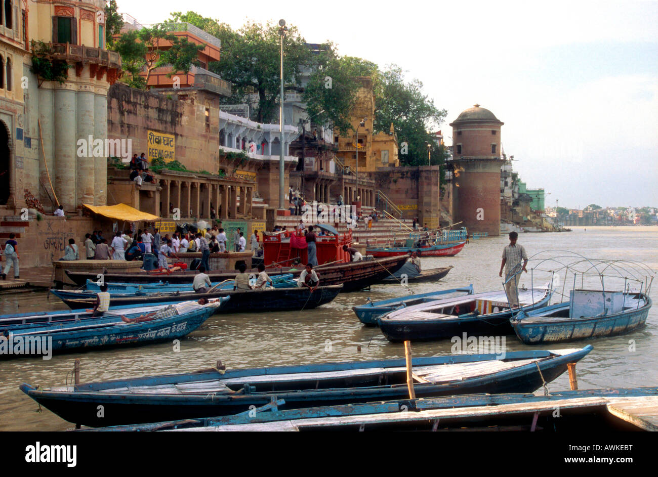 Local people and boats on the banks of the river Ganges at Varanasi, India Stock Photo