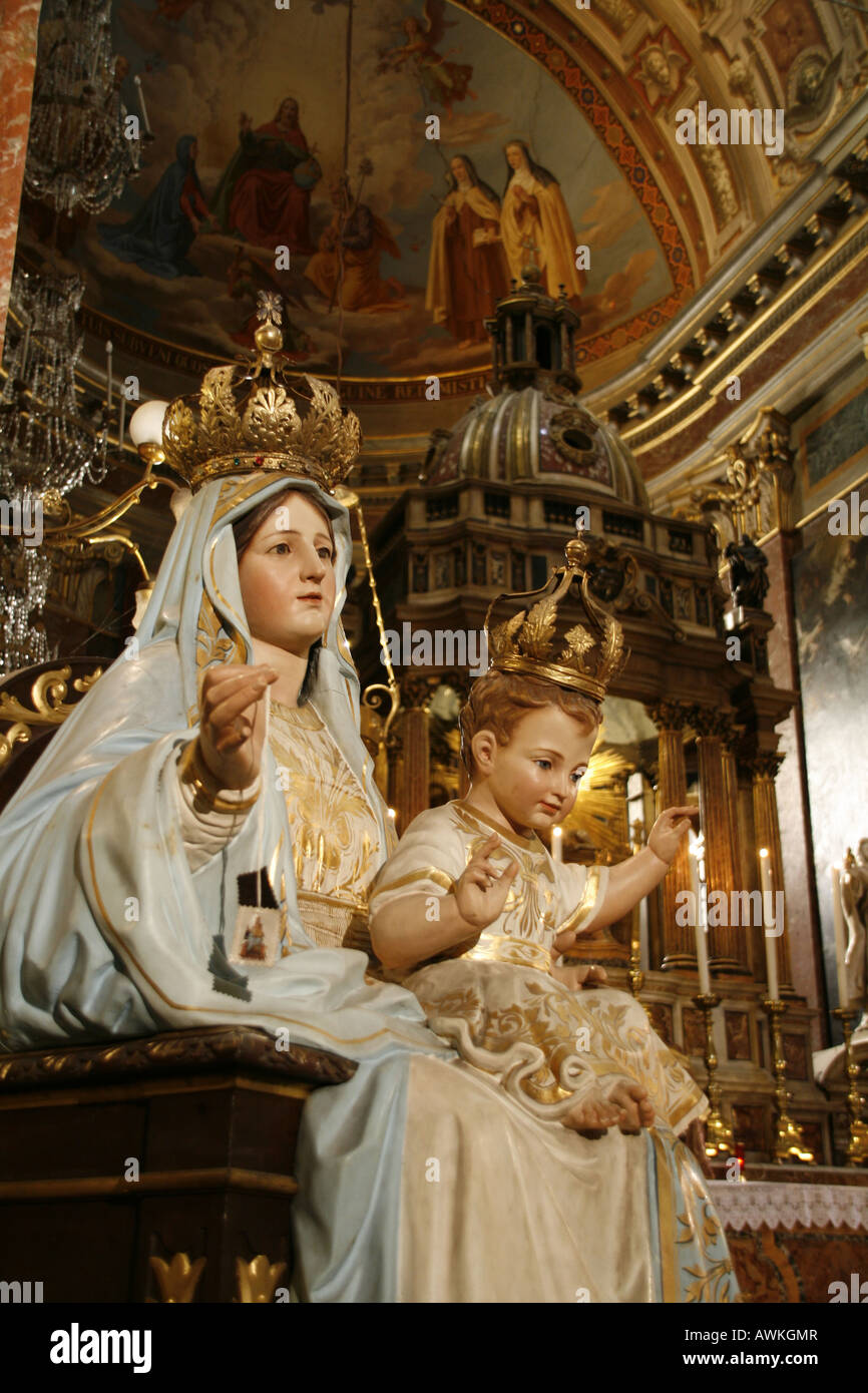 praying madonna with baby jesus statue in a church in rome italy Stock Photo