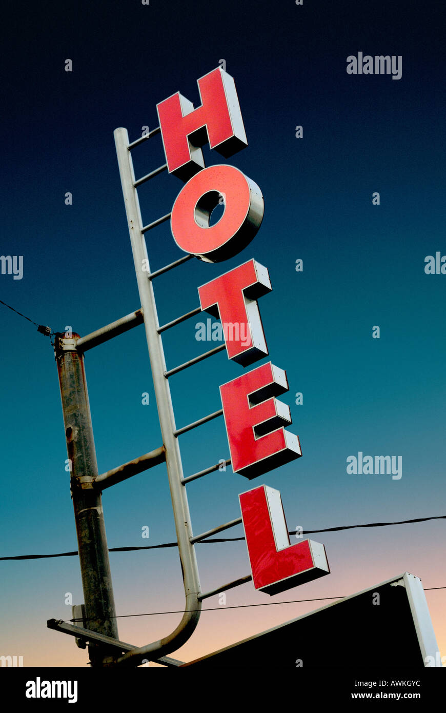 NEON HOTEL SIGN IN URBAN SETTING AGAINST NIGHT SKY Stock Photo - Alamy