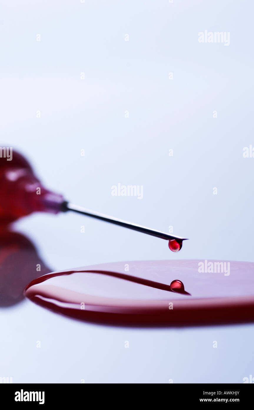 Injection syringe spilling blood Stock Photo Alamy