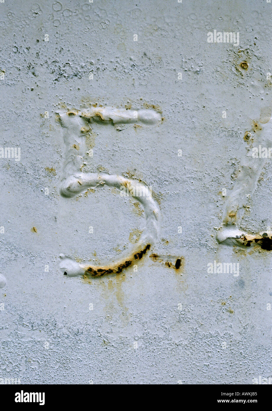 5 text, embossed and rusty on metal surface Stock Photo