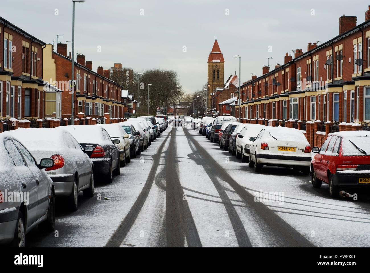Snow covering street and cars in Huxley Ave Manchester UK Stock Photo