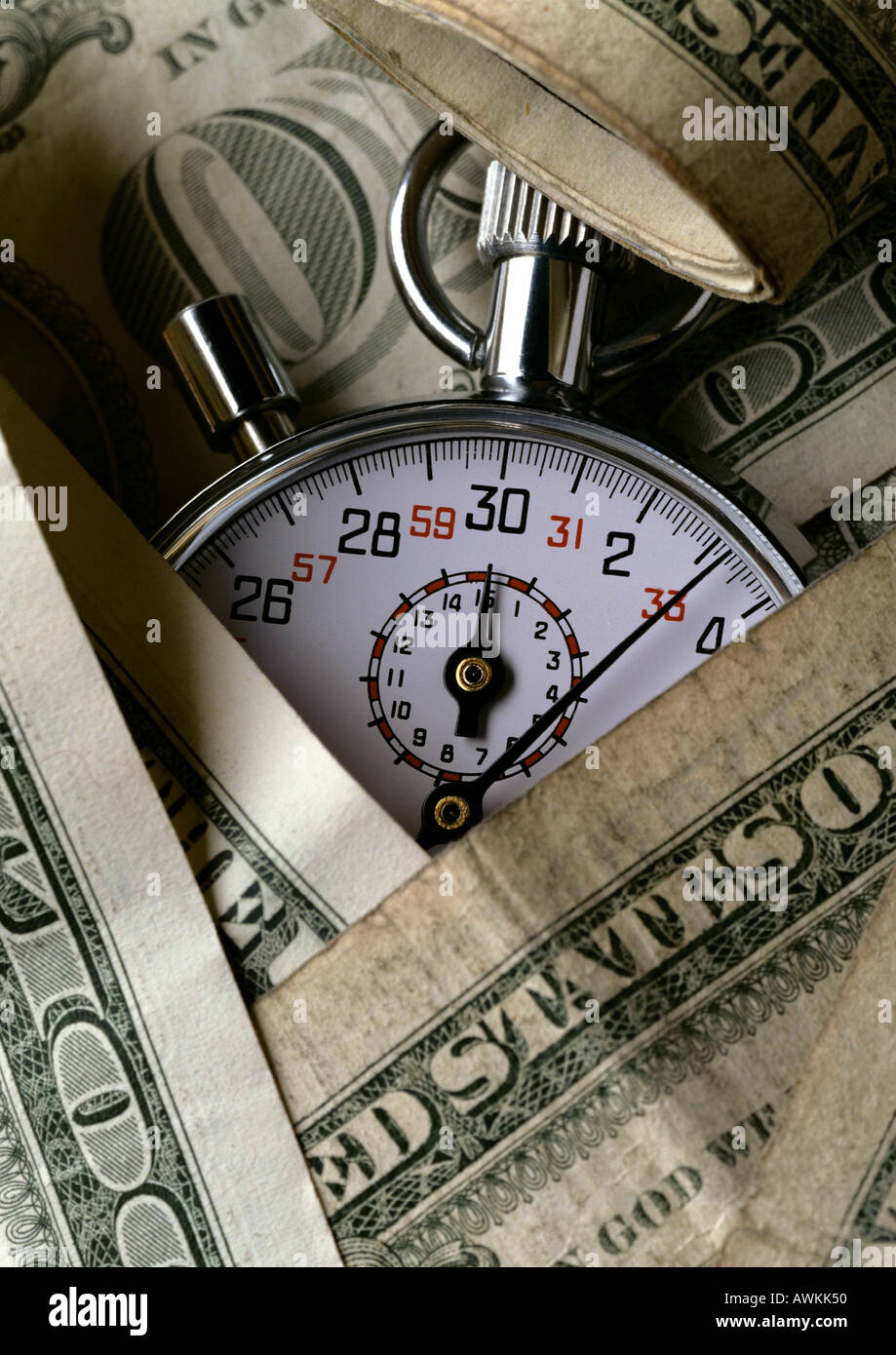 Money and stopwatch Stock Photo Alamy