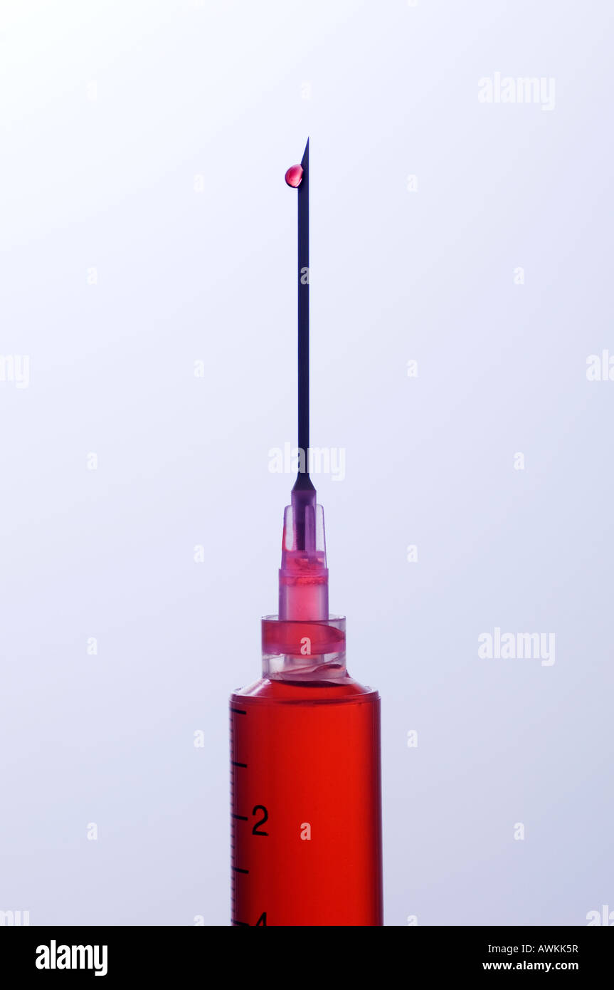 Hypodermic injection needle with one drop of blood Stock Photo Alamy