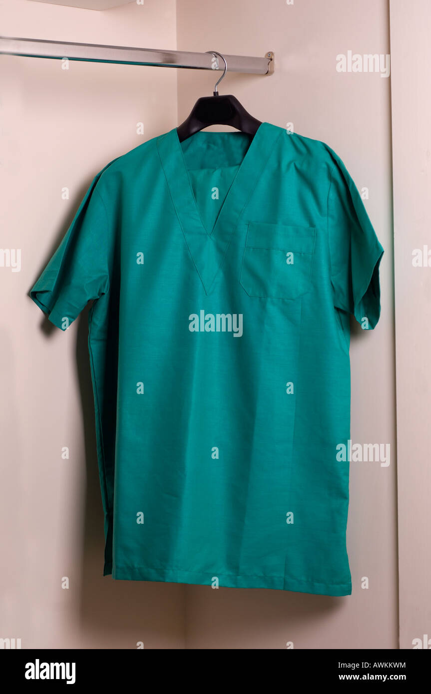 Green medical scrubs uniform on hanger Stock Photo Alamy