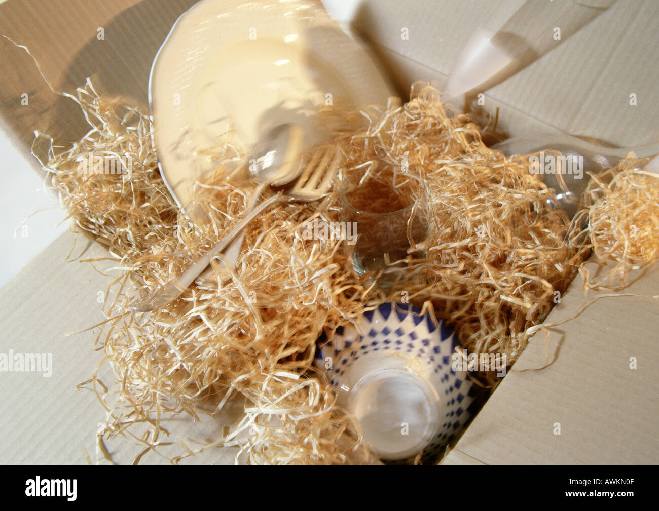 Dishes and silverware in packaging Stock Photo Alamy