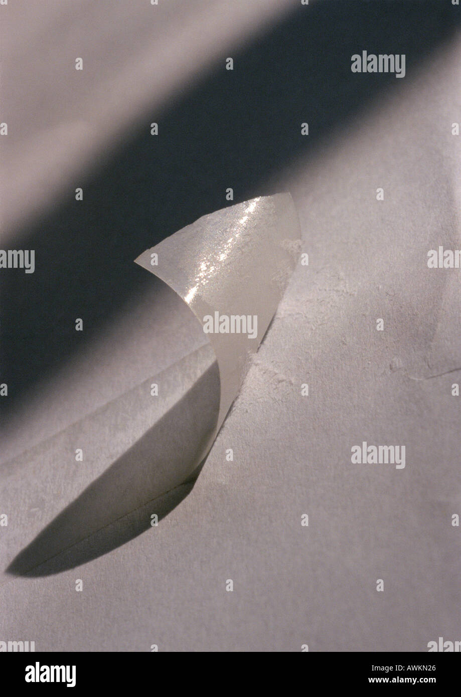 Tape peeling off paper Stock Photo Alamy