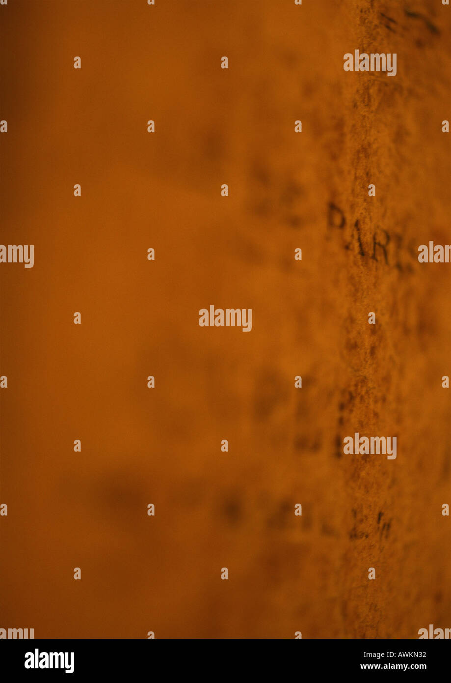 Writing on orange wall Stock Photo Alamy