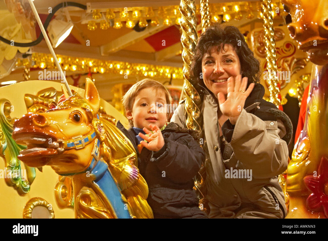 Children in colourful carousel traditional hi-res stock photography and ...