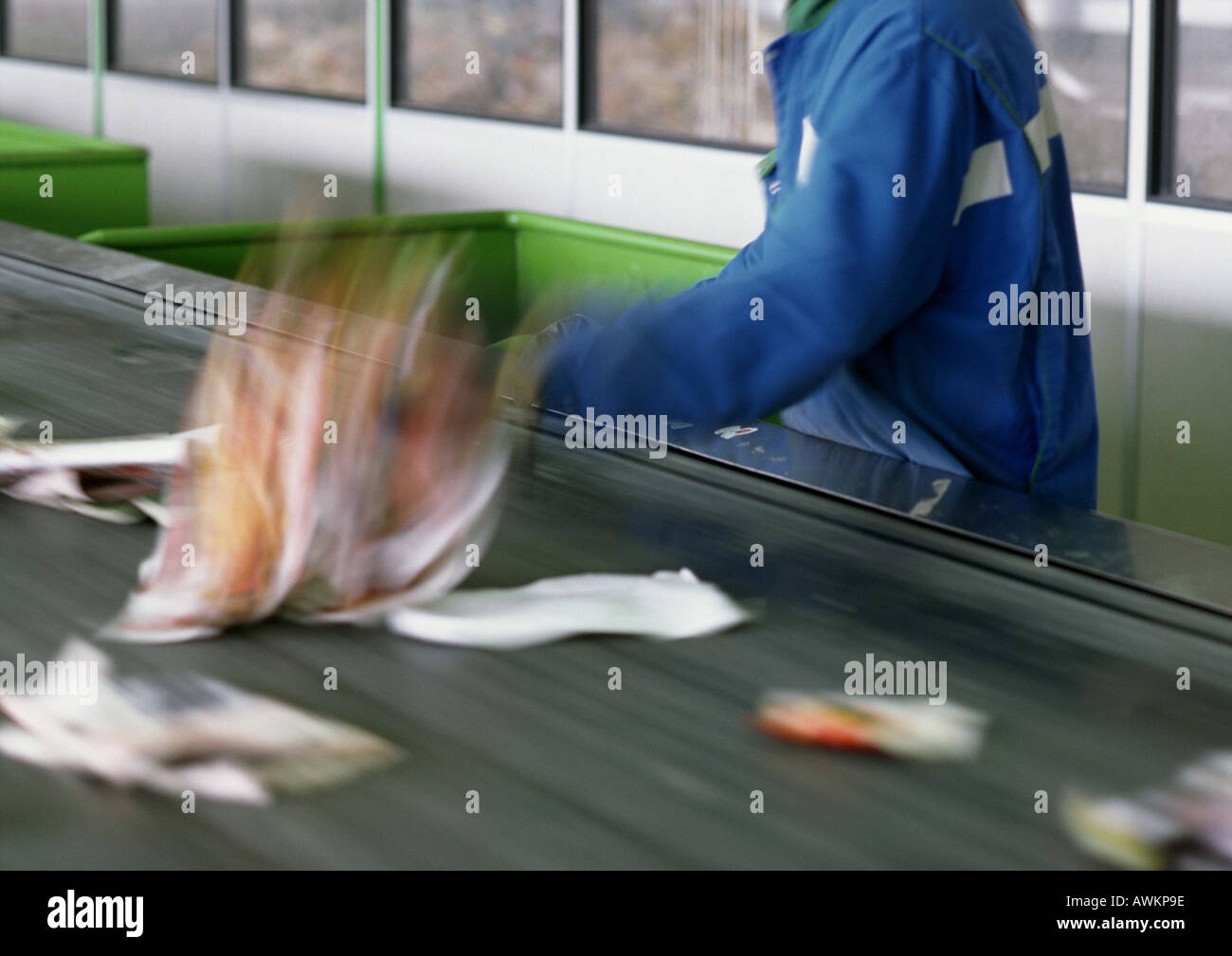 Trash being sorted on conveyor belt, cropped Stock Photo