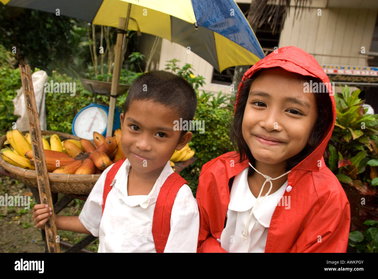philippines siquijor island larena town children with fruit stall Stock Photo