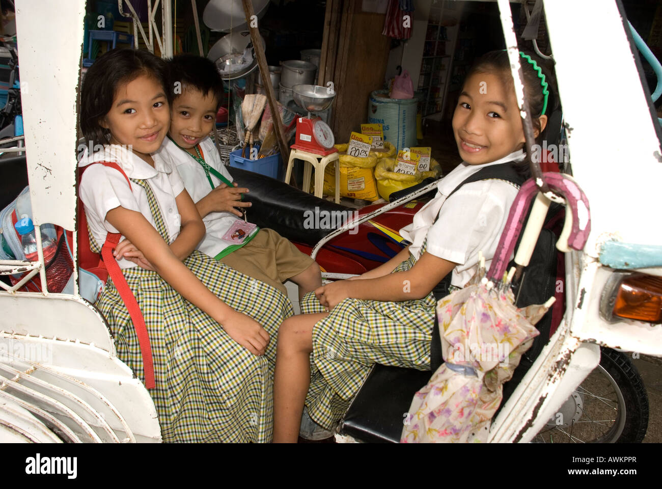 philippines siquijor island larena town school girls in tricycle Stock Photo