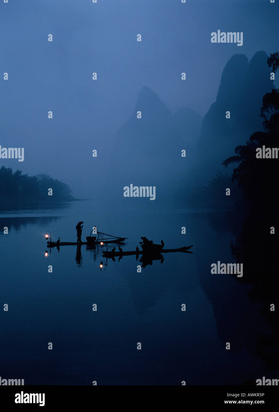 Chinese Fisherman on Rafts fishing with Cormorants, Li River, Hunan province of China, China Stock Photo