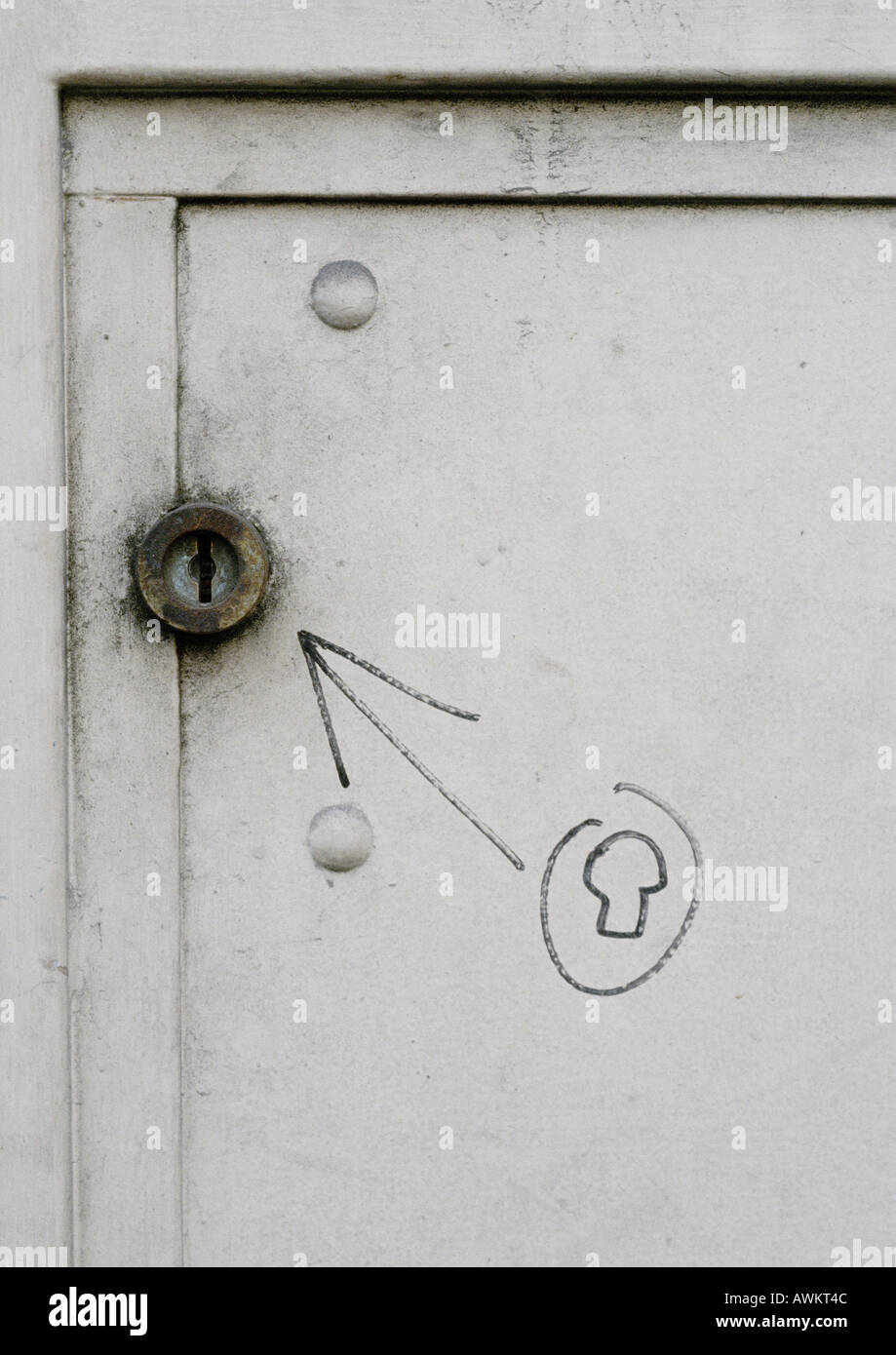 Drawing of lock and arrow pointing to real lock, close-up Stock Photo ...