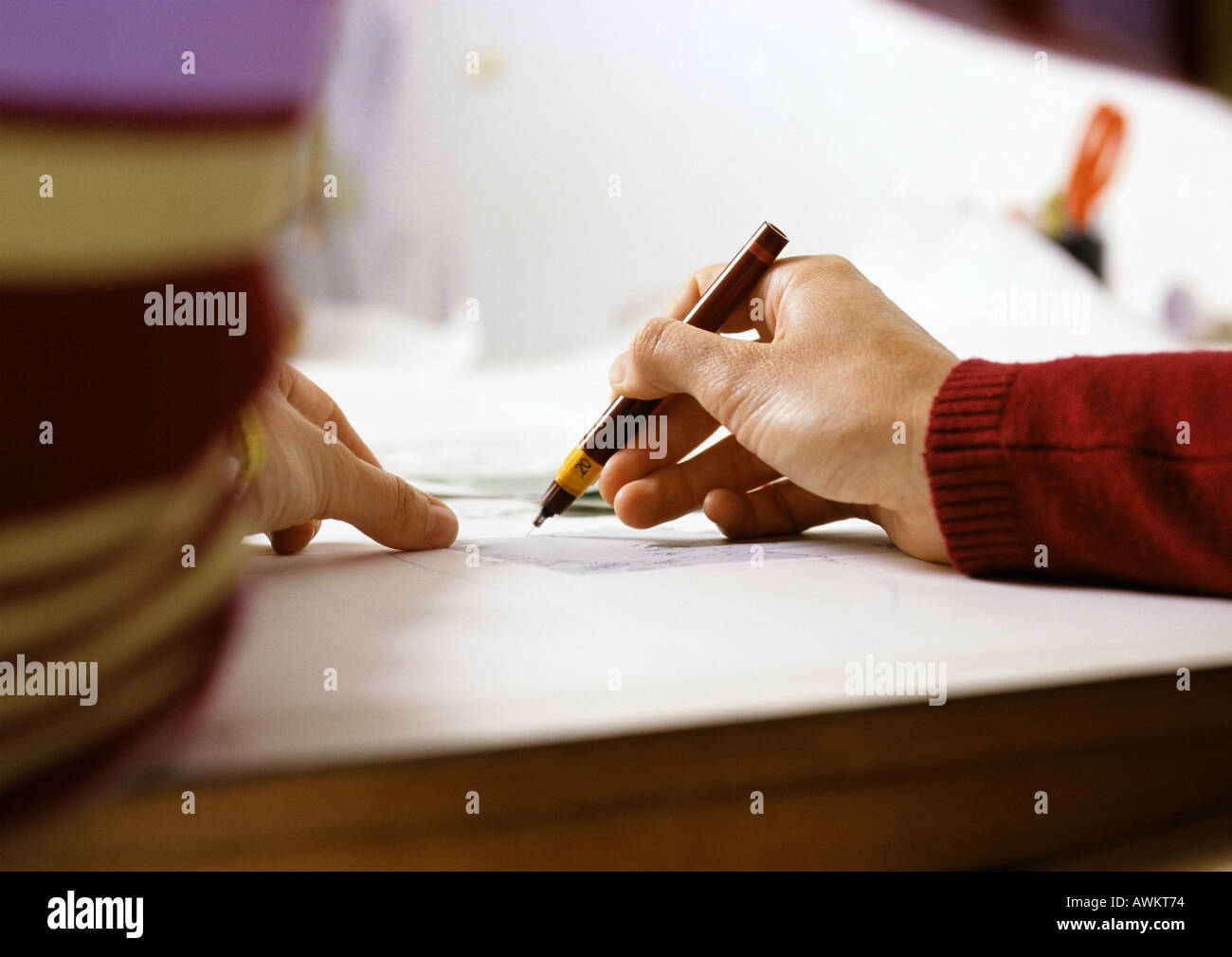 Hand holding pen, close-up Stock Photo