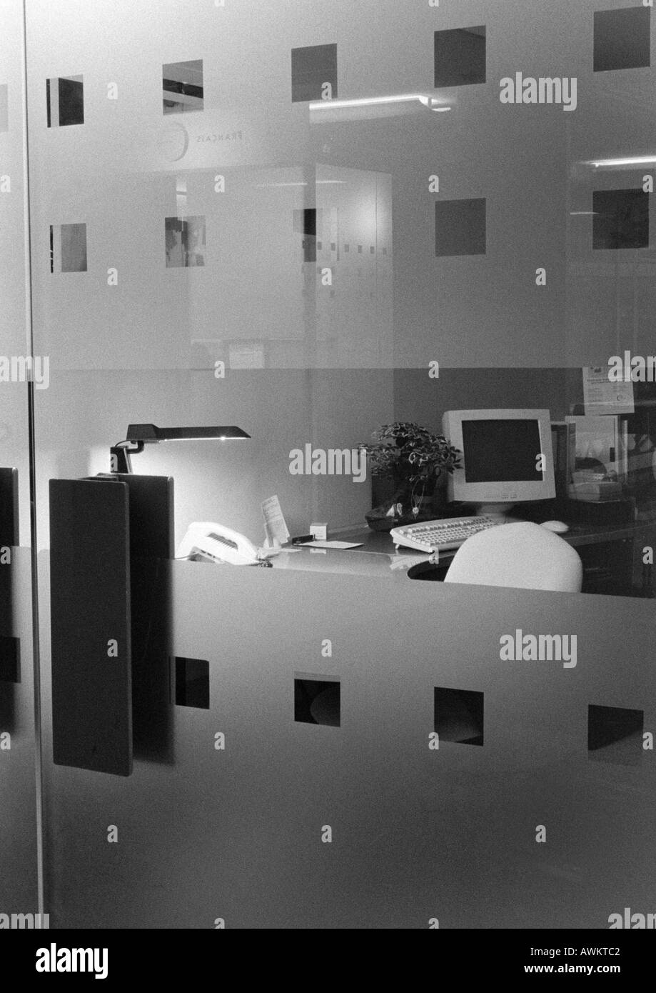 Desk behind glass doors, b&w Stock Photo Alamy