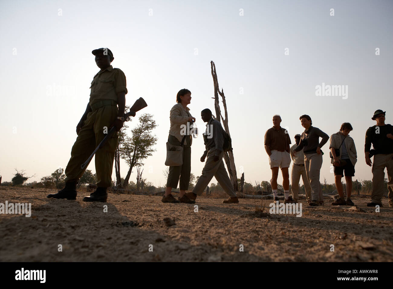 Walking safari africa rifle hi-res stock photography and images - Alamy