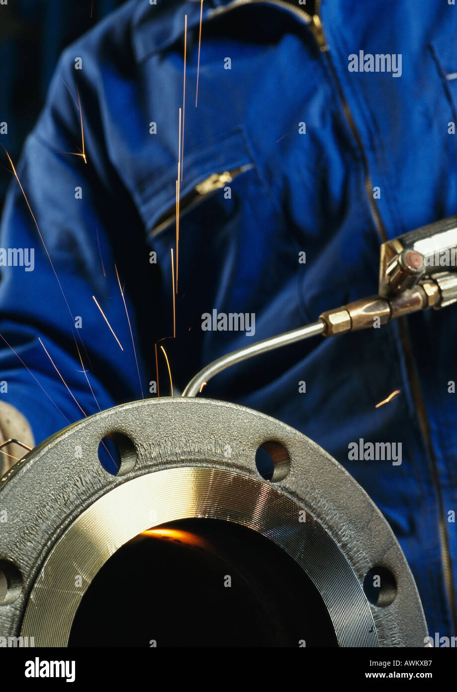 Person using welding torch, mid section Stock Photo Alamy